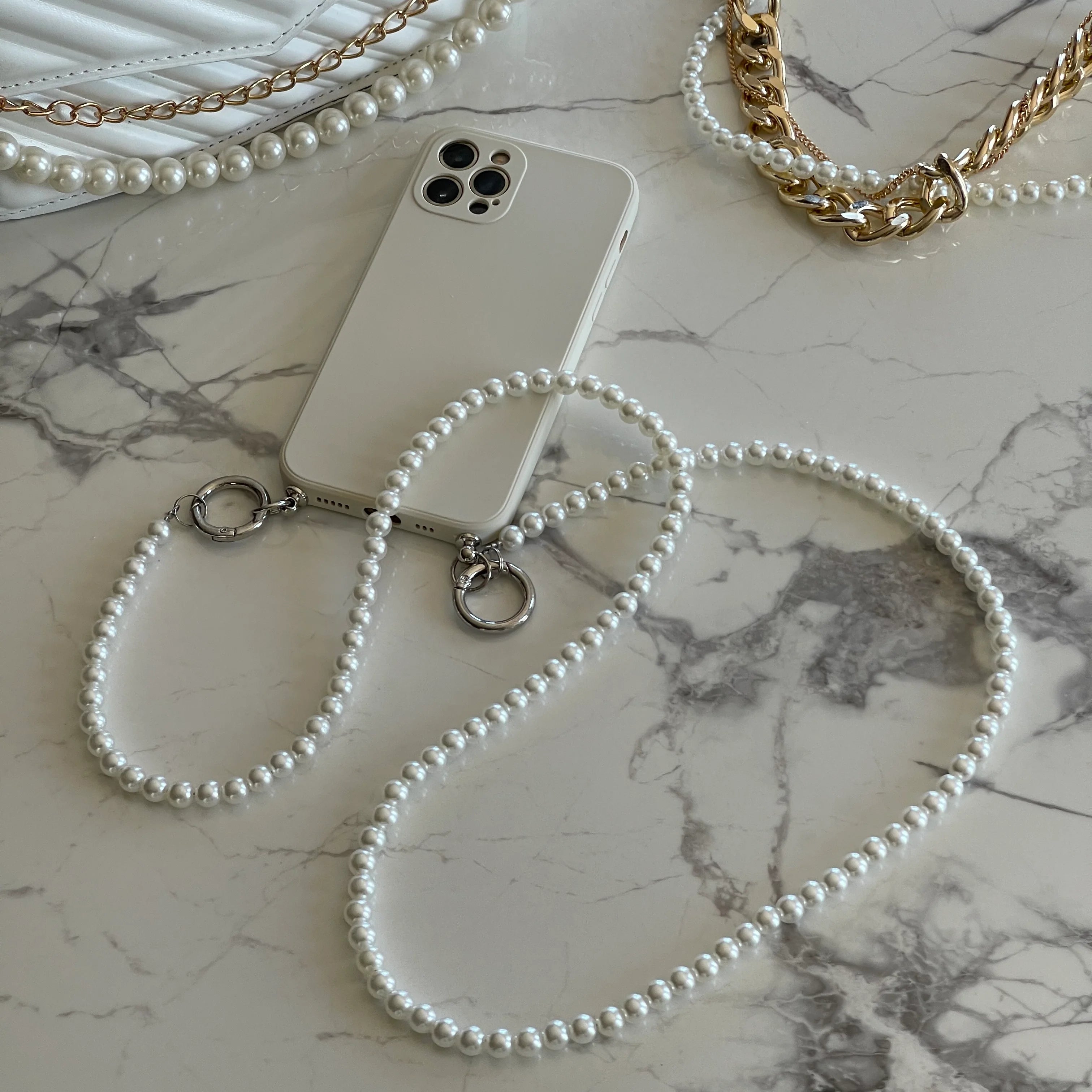 whiteiphonecasewithpearllanyard2.webp
